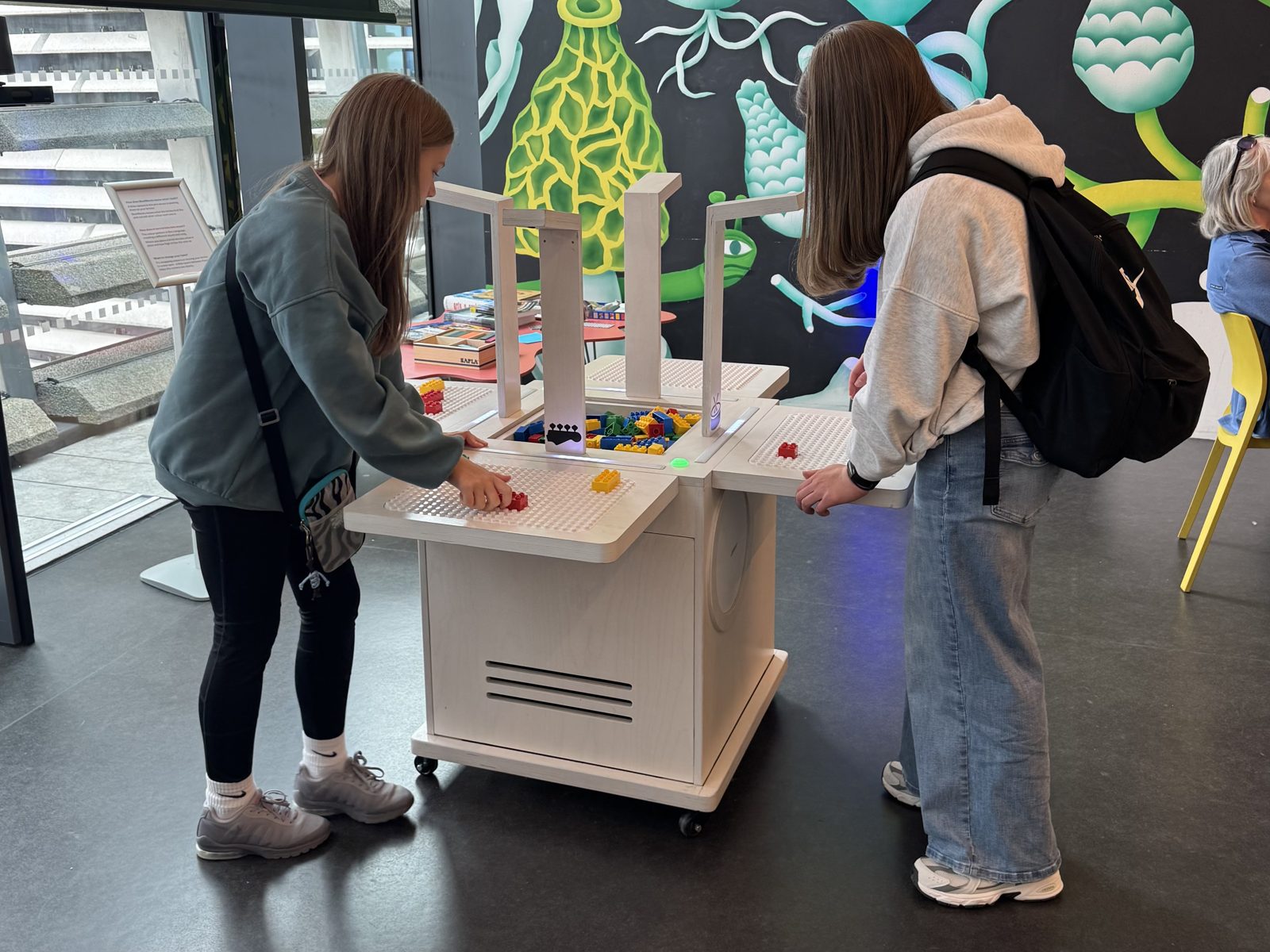 Two teenagers play BeatBlocks Live from either side of the unit in V&A Dundee's Robertson Studio.